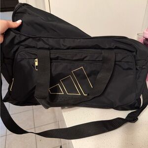 Adidas Men's Black Duffel Bag with Gold Accents